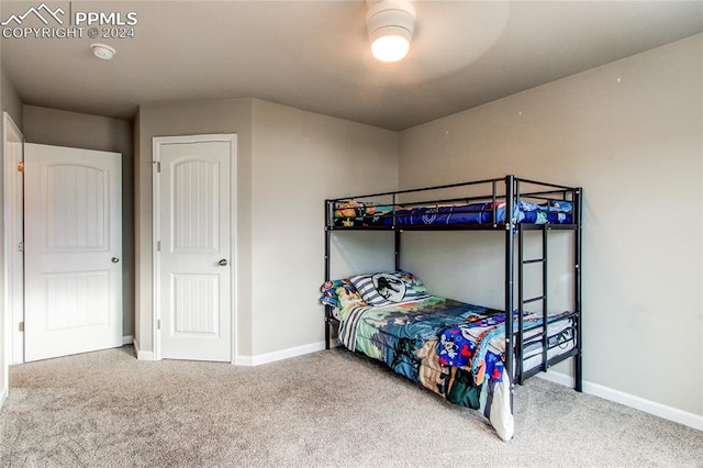 bedroom with ceiling fan and carpet