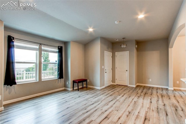 spare room featuring light hardwood / wood-style flooring