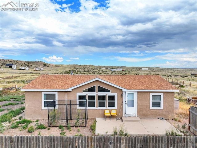 view of front of property featuring a patio