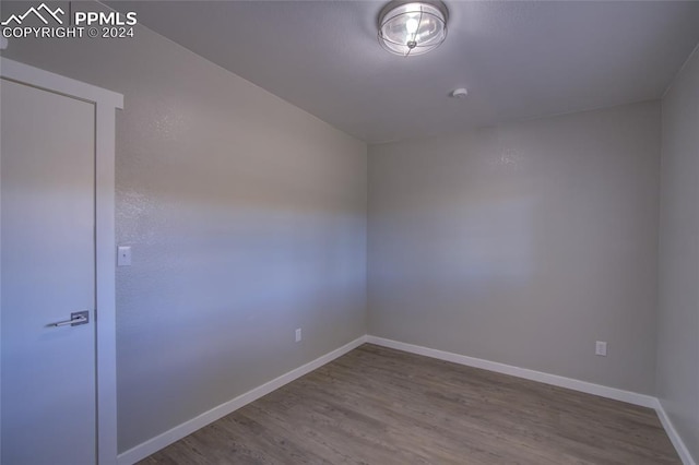 spare room featuring hardwood / wood-style flooring