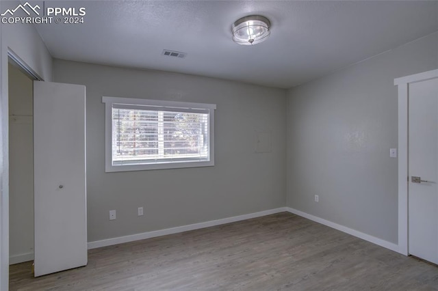 empty room featuring hardwood / wood-style floors