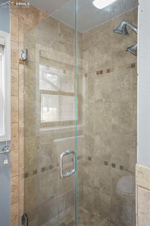 bathroom with an enclosed shower