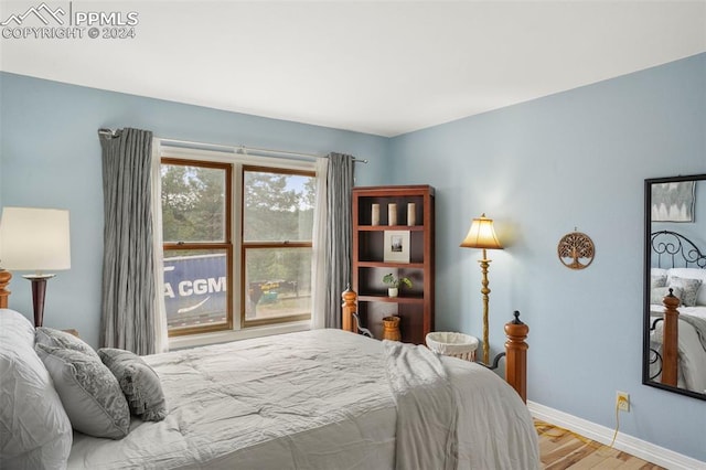 bedroom with light wood-type flooring