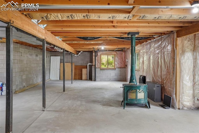 basement featuring a wood stove