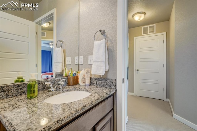 bathroom featuring tile patterned floors and vanity