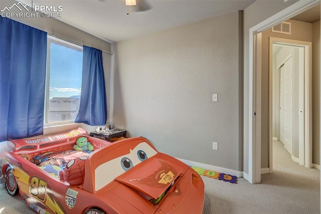 interior space with carpet floors, ceiling fan, and multiple windows