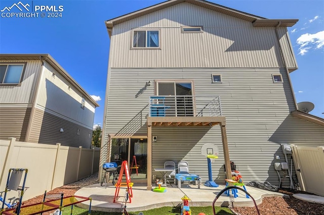 back of property with a patio