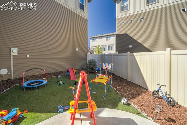 view of play area featuring a yard