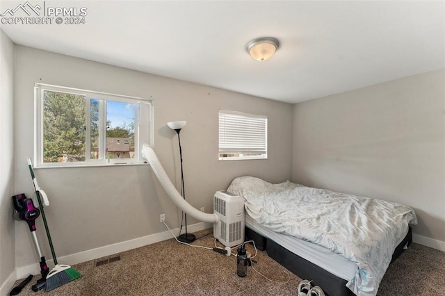 bedroom featuring carpet, baseboards, and visible vents