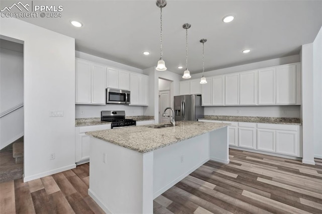 kitchen with white cabinetry, sink, a center island with sink, and appliances with stainless steel finishes