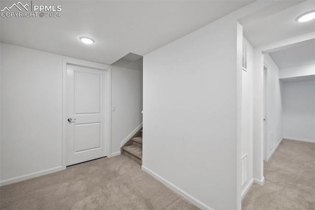 basement with light colored carpet