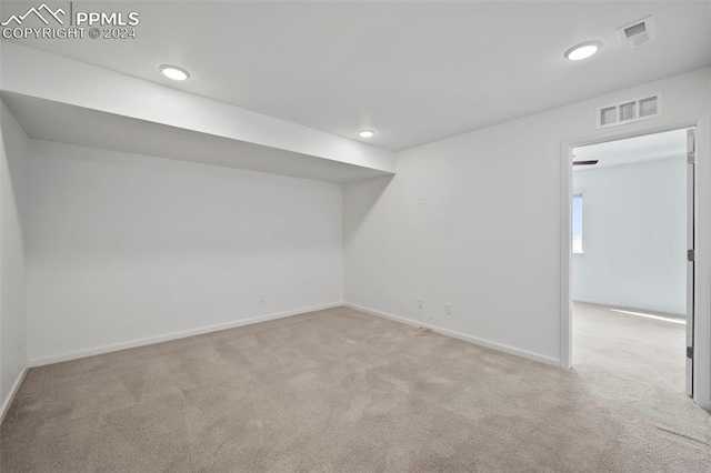 basement with light colored carpet