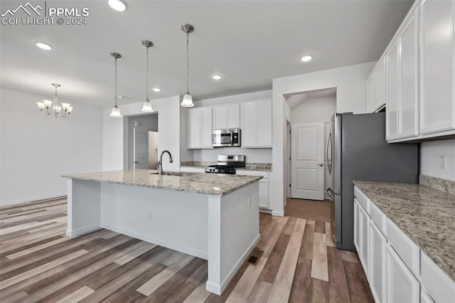 kitchen featuring light wood-type flooring, white cabinetry, sink, and appliances with stainless steel finishes