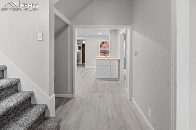 hallway with light hardwood / wood-style flooring