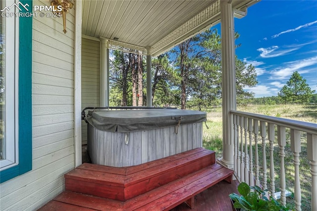 deck featuring a hot tub