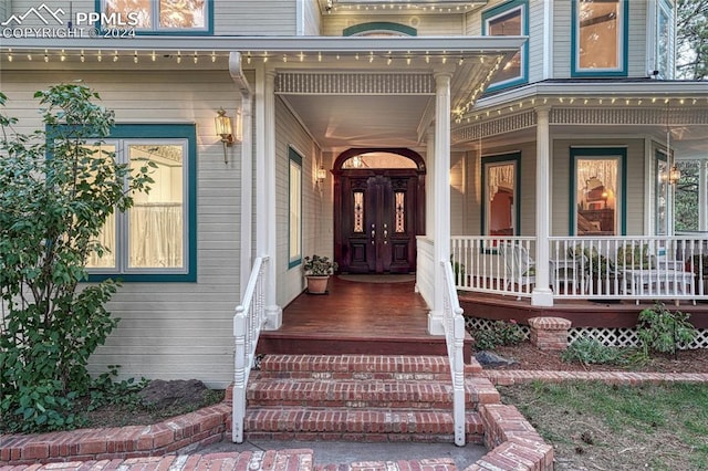 property entrance featuring covered porch