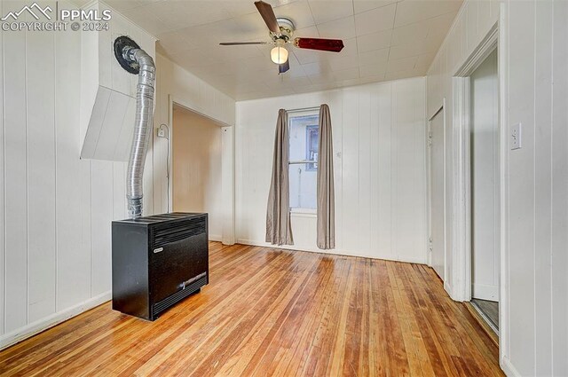 living room with ceiling fan and light hardwood / wood-style flooring