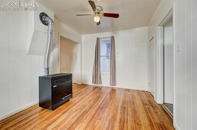 interior space featuring a ceiling fan and hardwood / wood-style floors