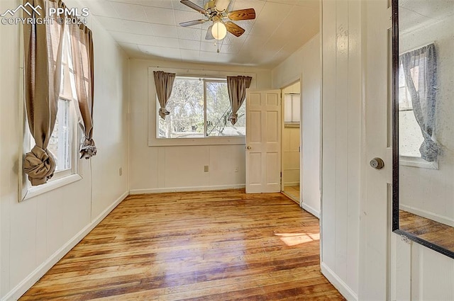 interior space with ceiling fan and light hardwood / wood-style floors