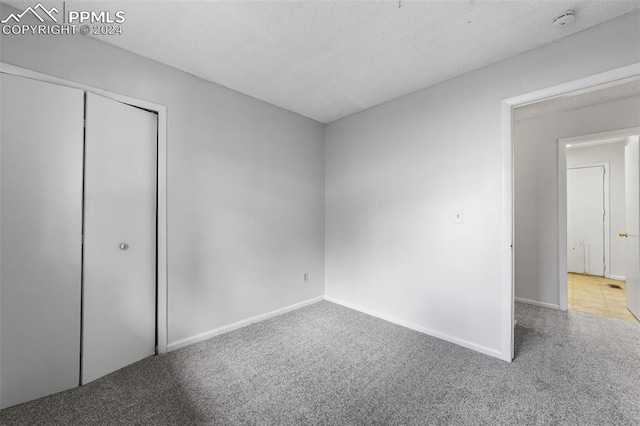 unfurnished bedroom featuring light colored carpet