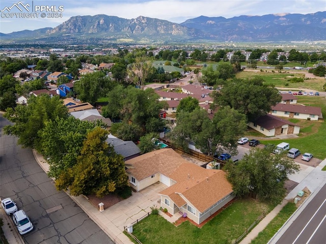 birds eye view of property with a mountain view