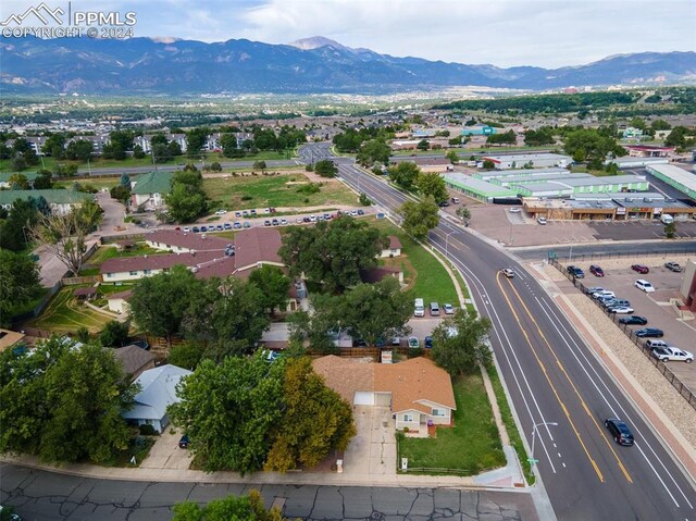 birds eye view of property featuring a mountain view