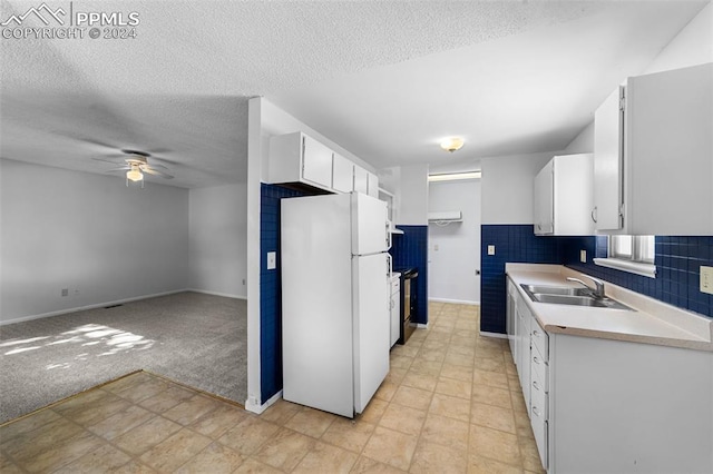 kitchen featuring ceiling fan, decorative backsplash, white fridge, sink, and light tile patterned flooring