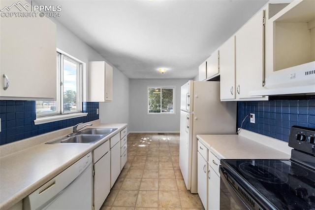 kitchen featuring decorative backsplash, white cabinetry, sink, light tile patterned flooring, and white appliances