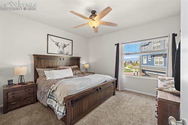 bedroom featuring ceiling fan and light carpet