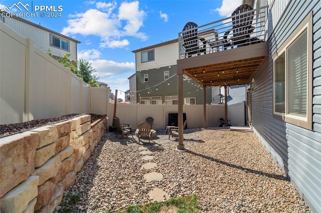 view of yard featuring a balcony