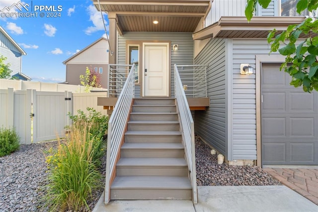 view of exterior entry featuring a garage