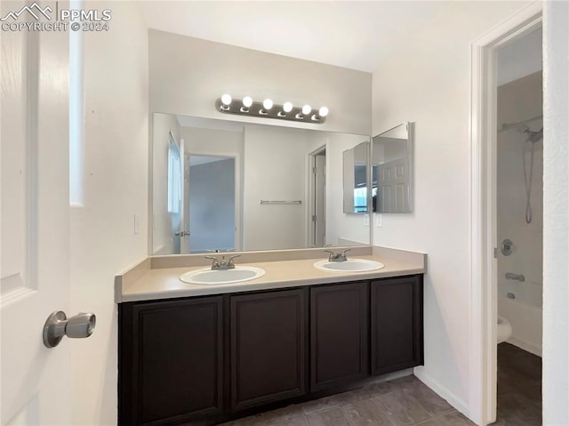 full bathroom featuring tile patterned floors, toilet, shower / tub combination, and vanity