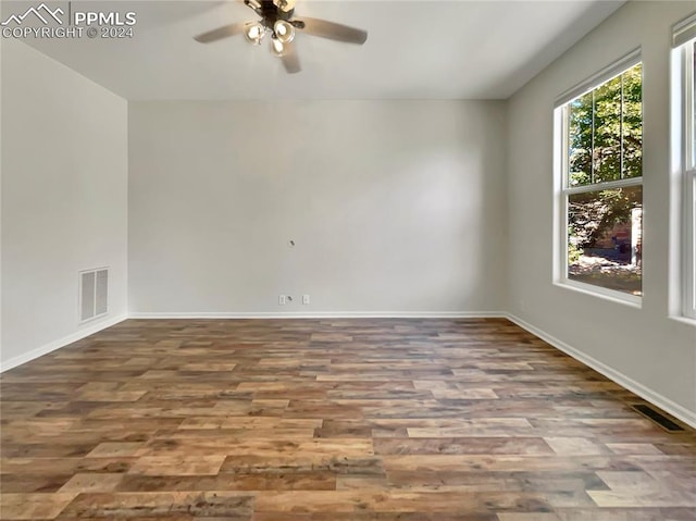 unfurnished room featuring ceiling fan and hardwood / wood-style flooring