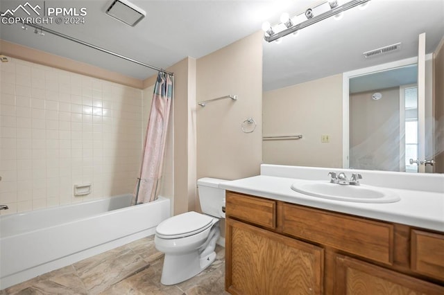 full bathroom featuring vanity, toilet, and shower / tub combo