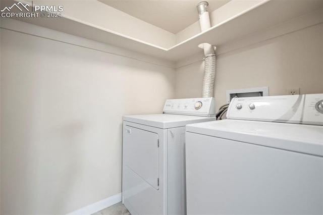 140 W Rockrimmon Blvd Unit 204, Colorado Springs, CO 80919 - laundry room featuring baseboards, washer and dryer, and laundry area
