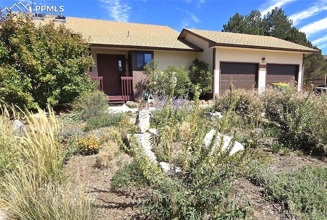 single story home with a garage