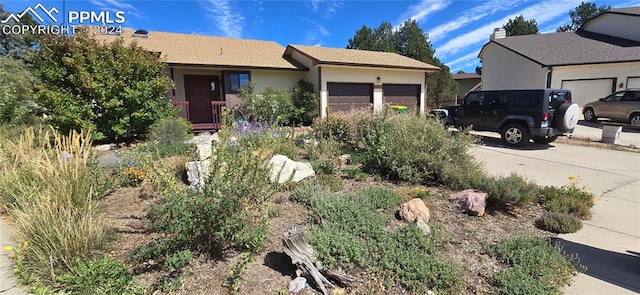 ranch-style home featuring a garage