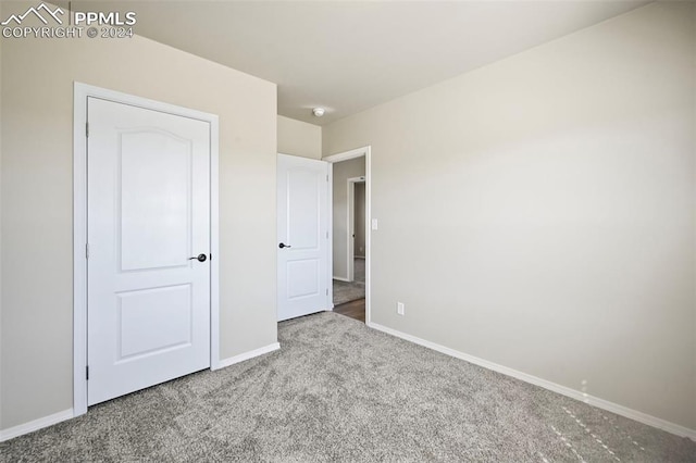 unfurnished bedroom featuring carpet floors