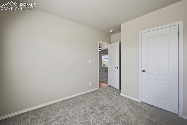 unfurnished bedroom featuring carpet