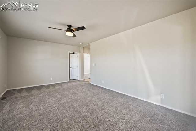 spare room with ceiling fan and carpet floors