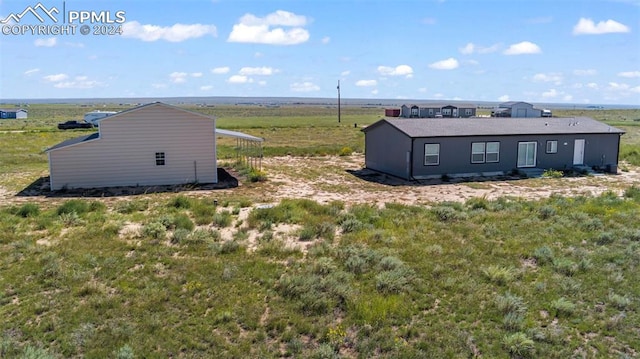 exterior space with a rural view