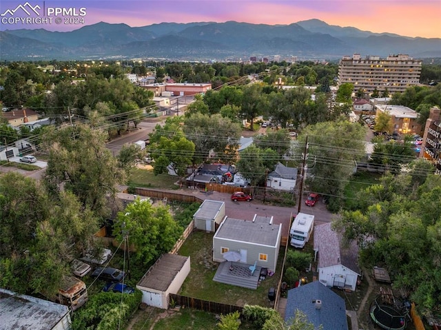 aerial view at dusk featuring a mountain view