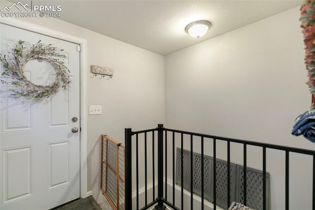 entryway with a textured ceiling