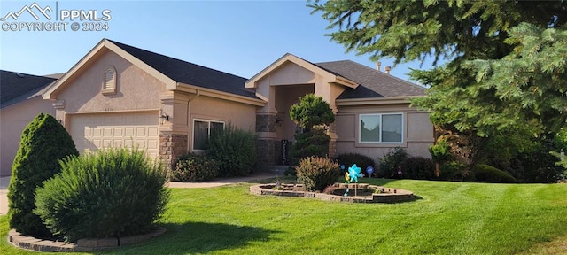 single story home featuring a front yard and a garage