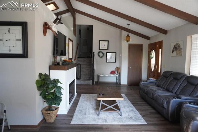 living room with dark wood-type flooring and lofted ceiling with beams