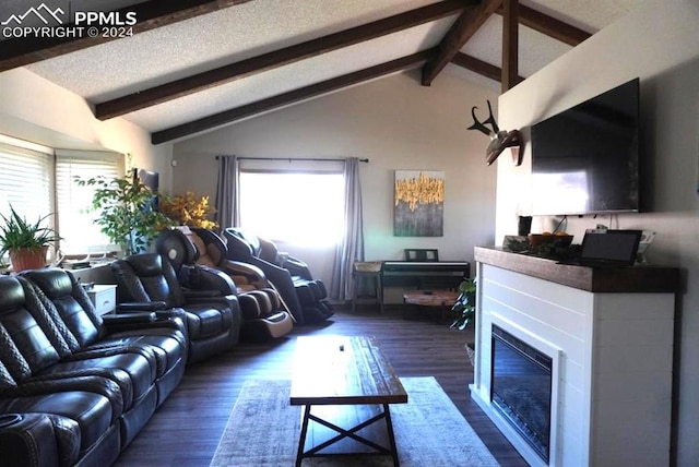 living room with lofted ceiling with beams, a textured ceiling, and dark hardwood / wood-style floors