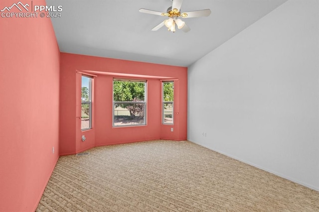 empty room featuring ceiling fan and carpet floors