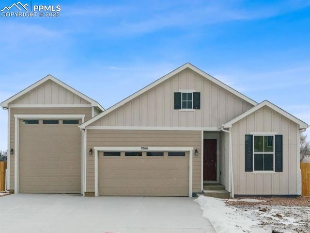 view of front of home with an attached garage and concrete driveway