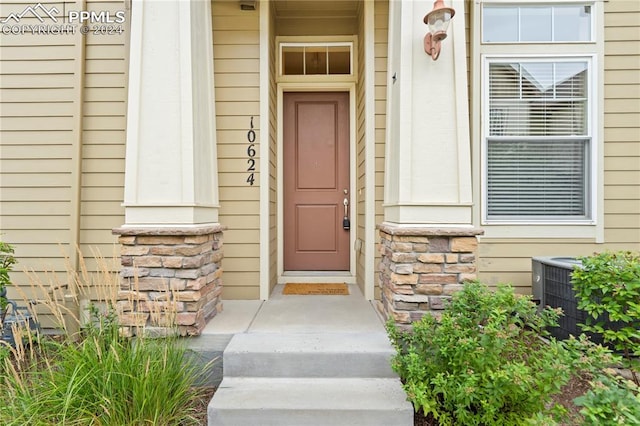 entrance to property with central AC unit