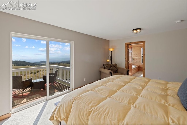 bedroom with carpet flooring and access to outside